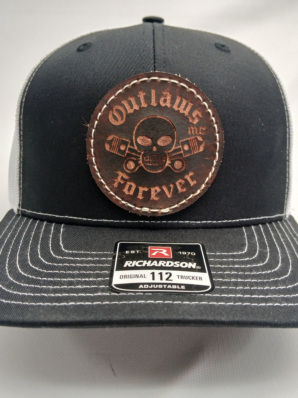 Richardson Black Trucker Cap with Brown Leather Outlaws Patch